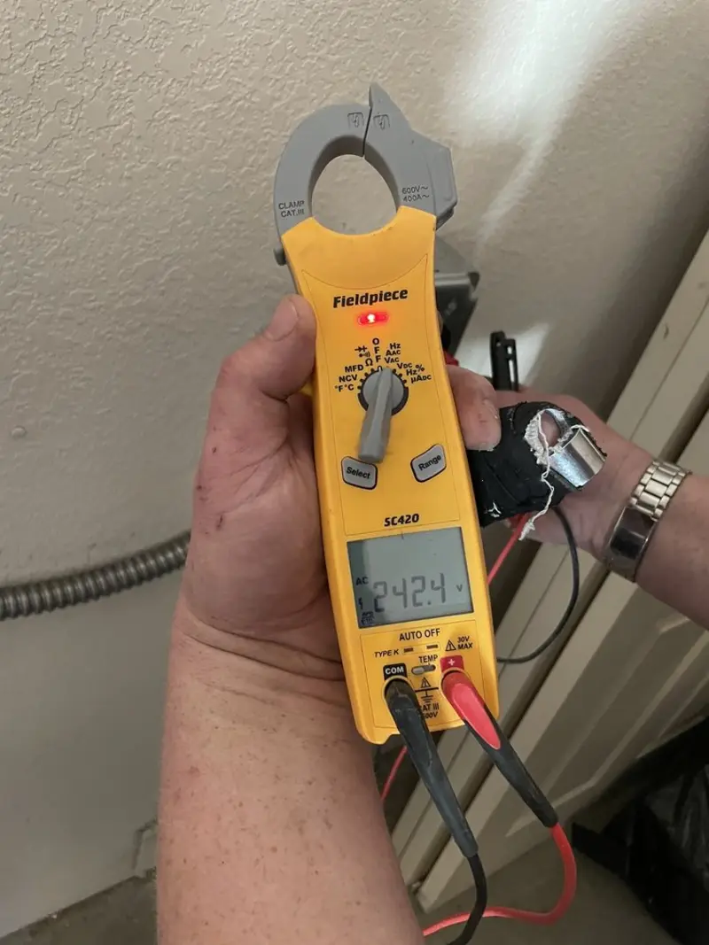 Voltage testing with clamp meter during Recessed Lighting Installation in San Carlos